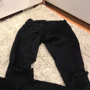 Black jeans with knee holes
